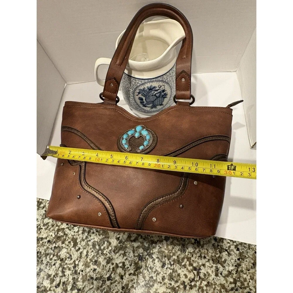 brown faux-leather Justin Naja Concho bag accented with a turquoise